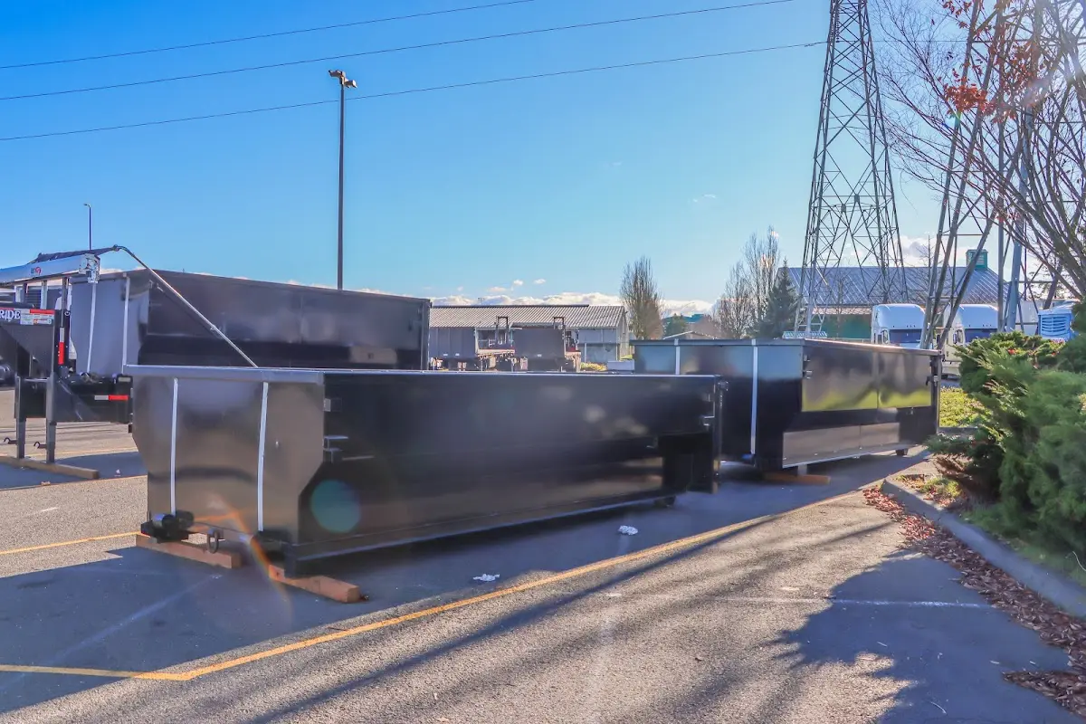 Roll-off dumpster ready for waste disposal at job site for Concrete Dumpster Rental in Smithtown